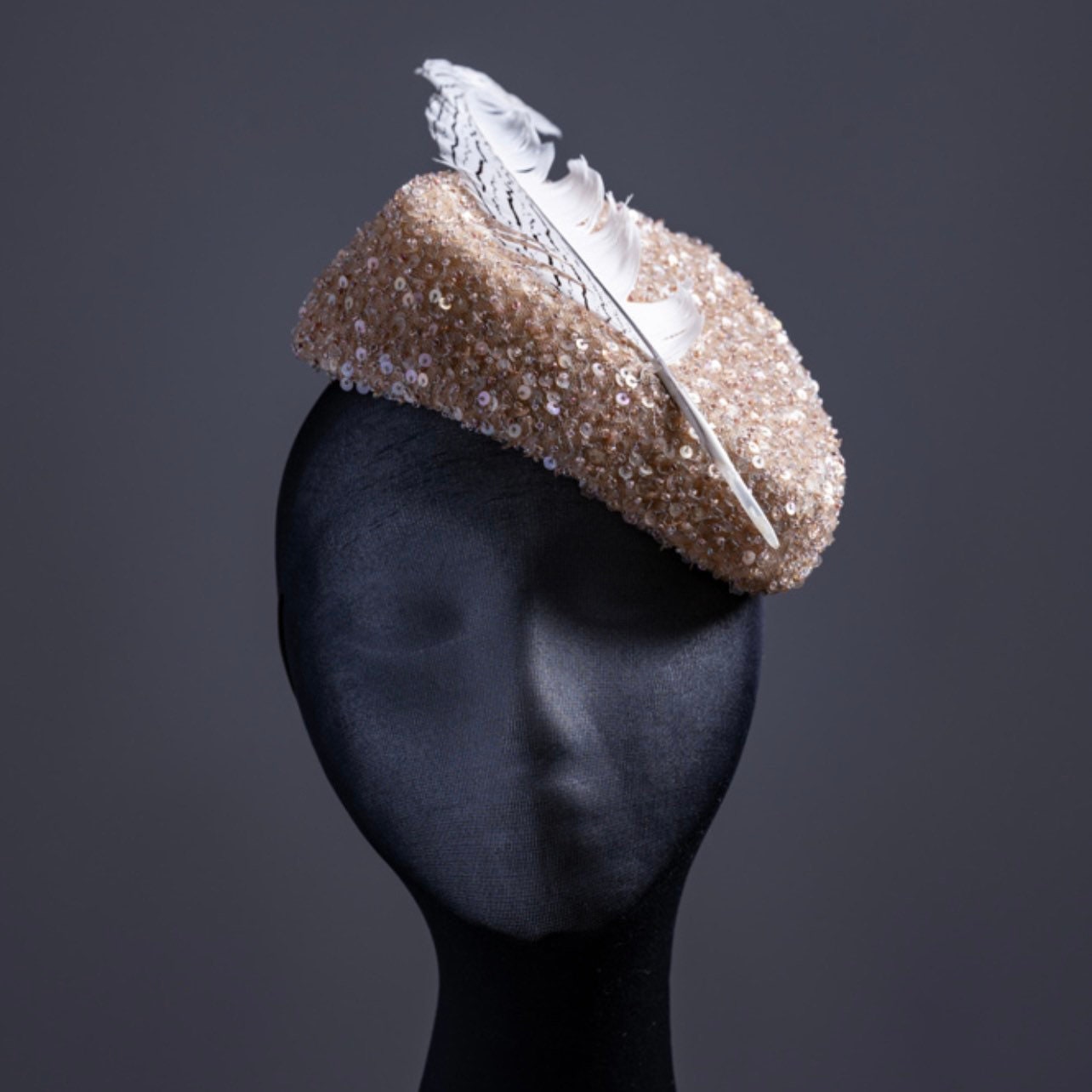 Triangular  Sequin gold tones Fascinator.
