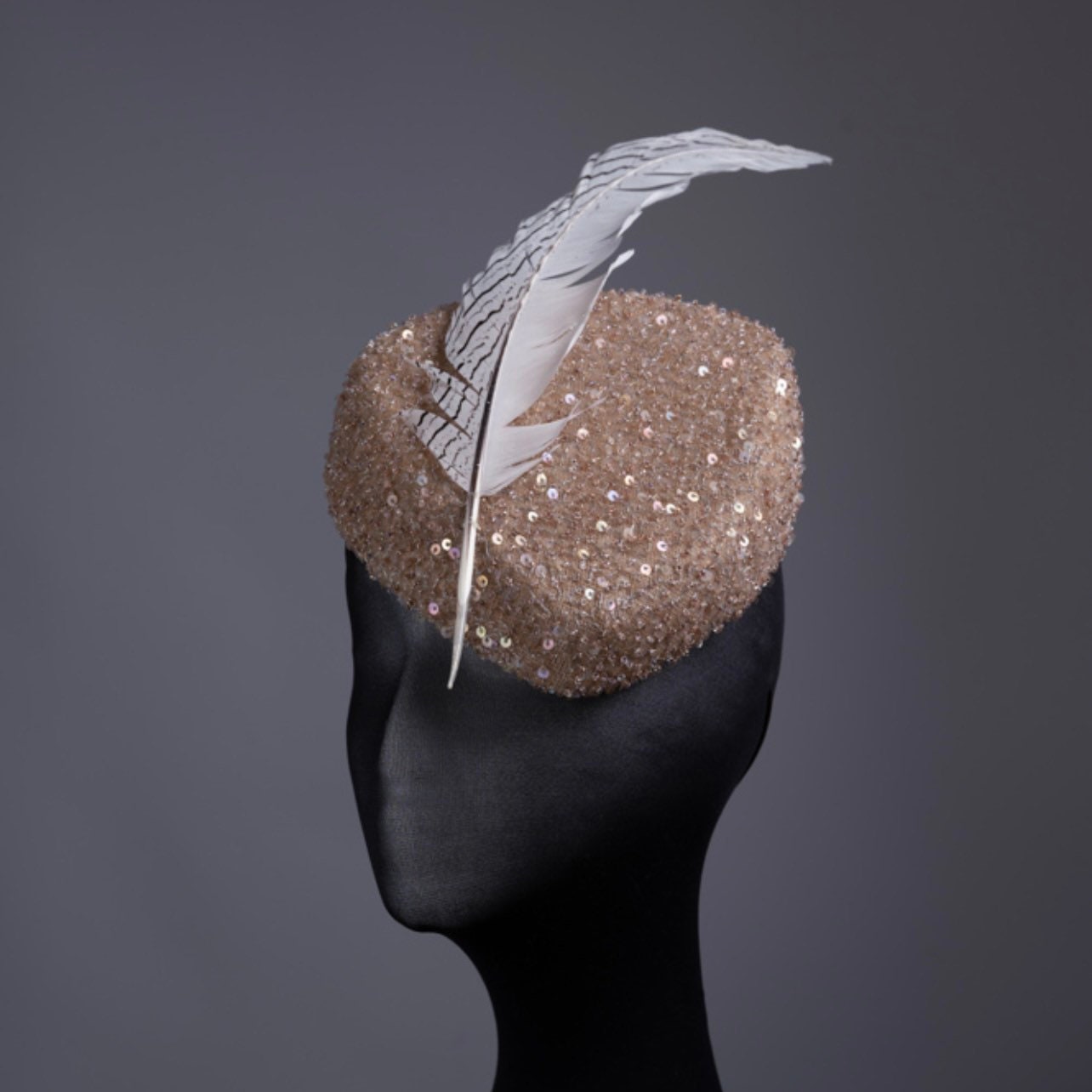 Triangular  Sequin gold tones Fascinator.