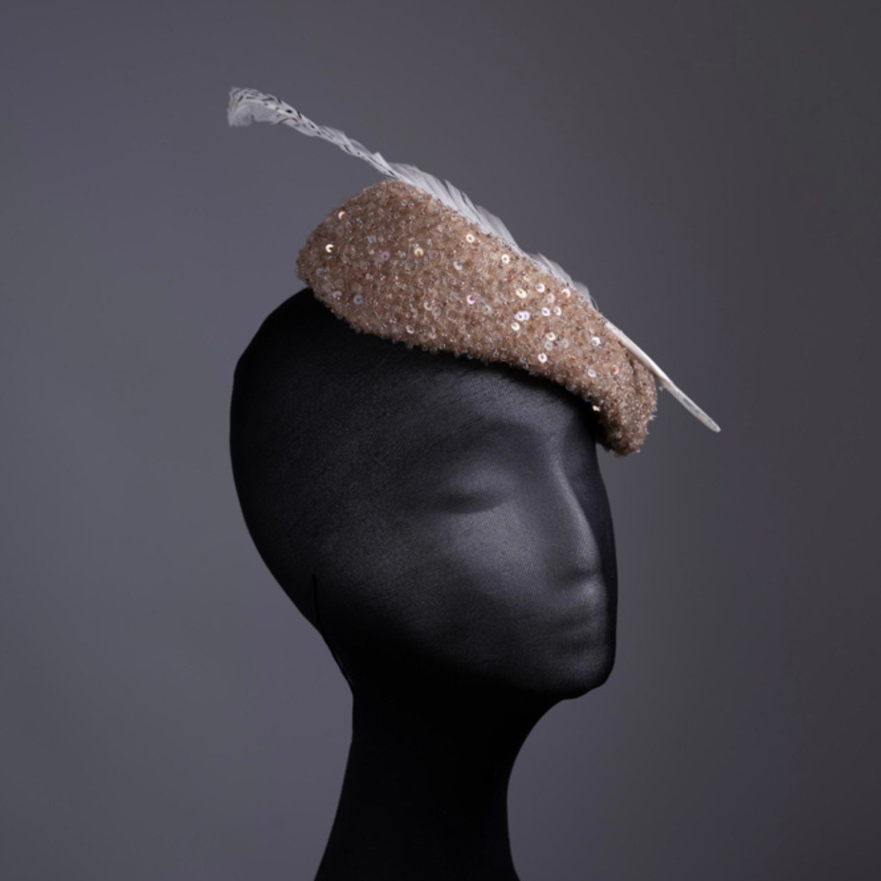 Triangular  Sequin gold tones Fascinator.