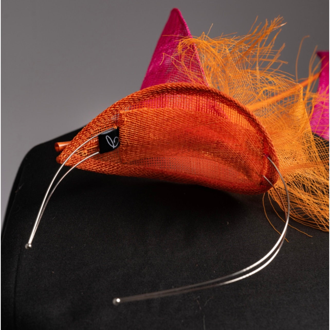 Dancing Flame Fascinator. Pink and Orange.