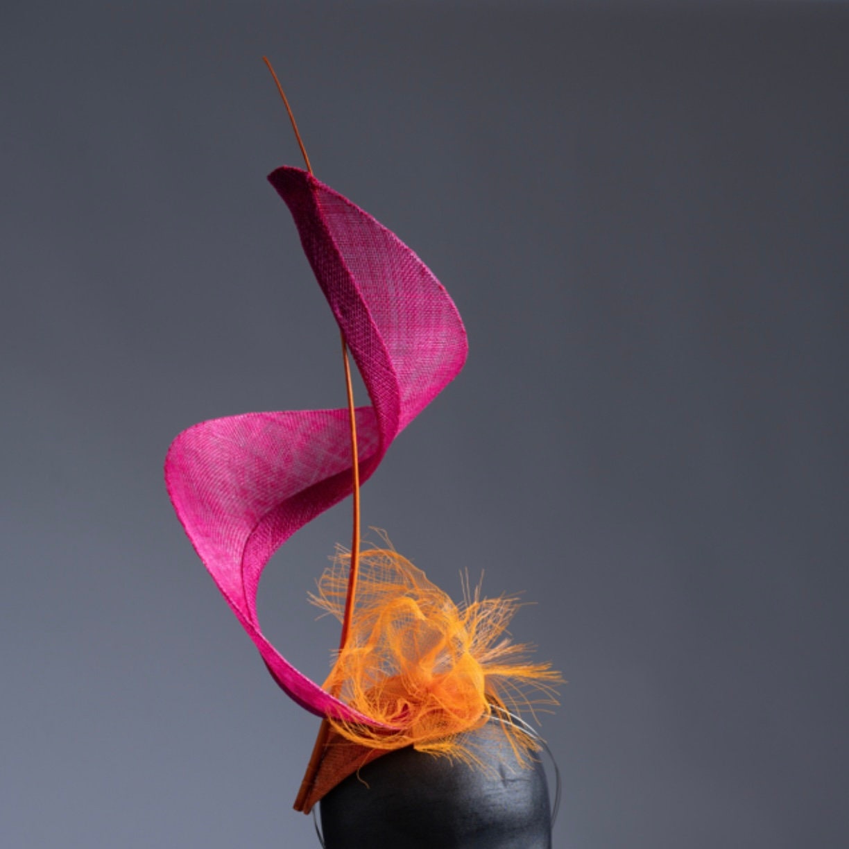 Dancing Flame Fascinator. Pink and Orange.