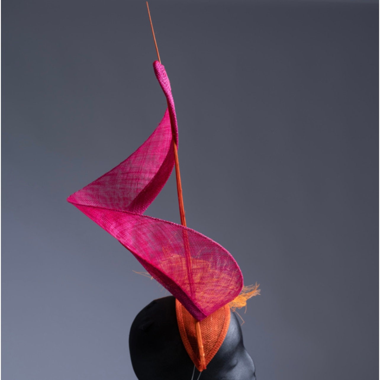 Dancing Flame Fascinator. Pink and Orange.