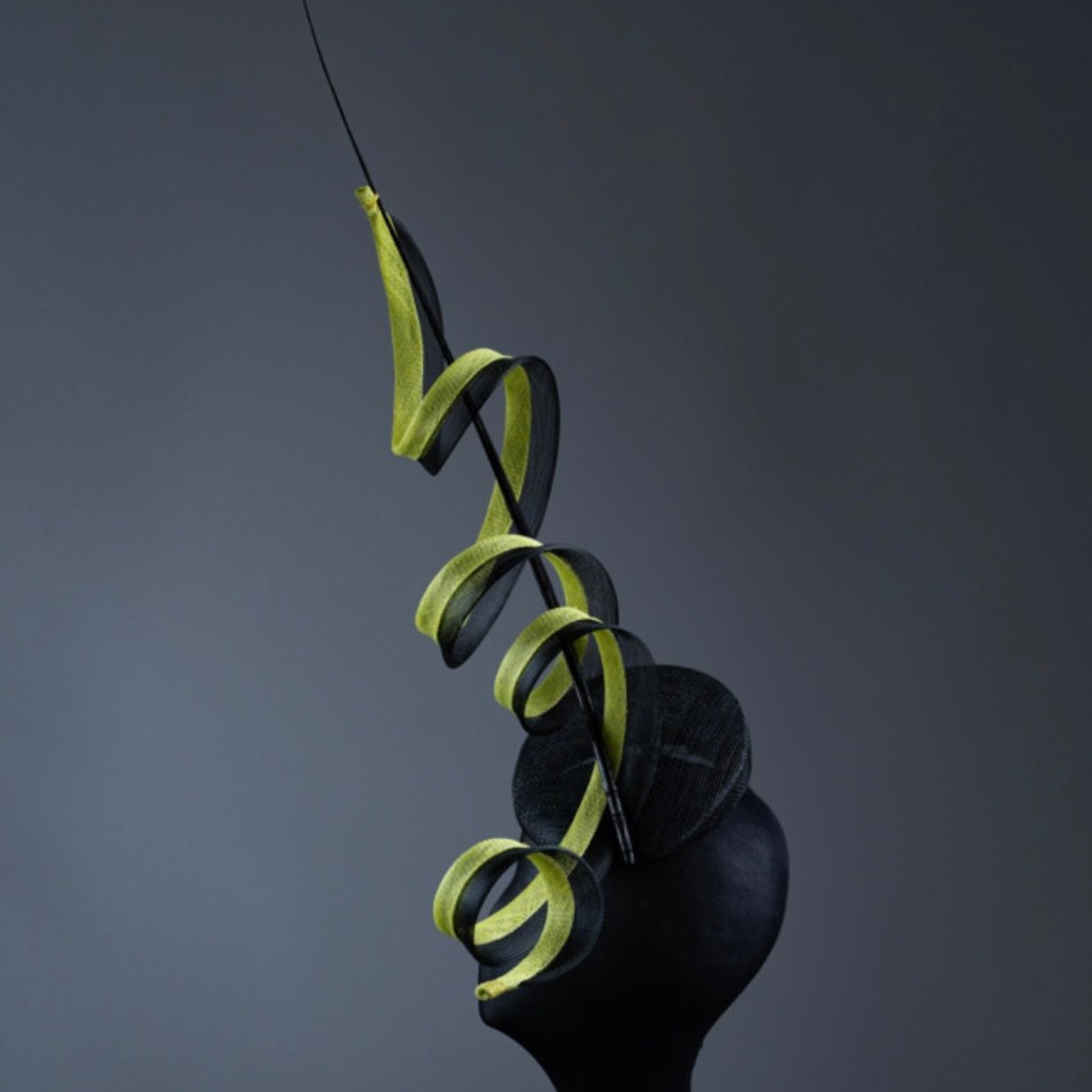 Black and acid yellow coiling Fascinator