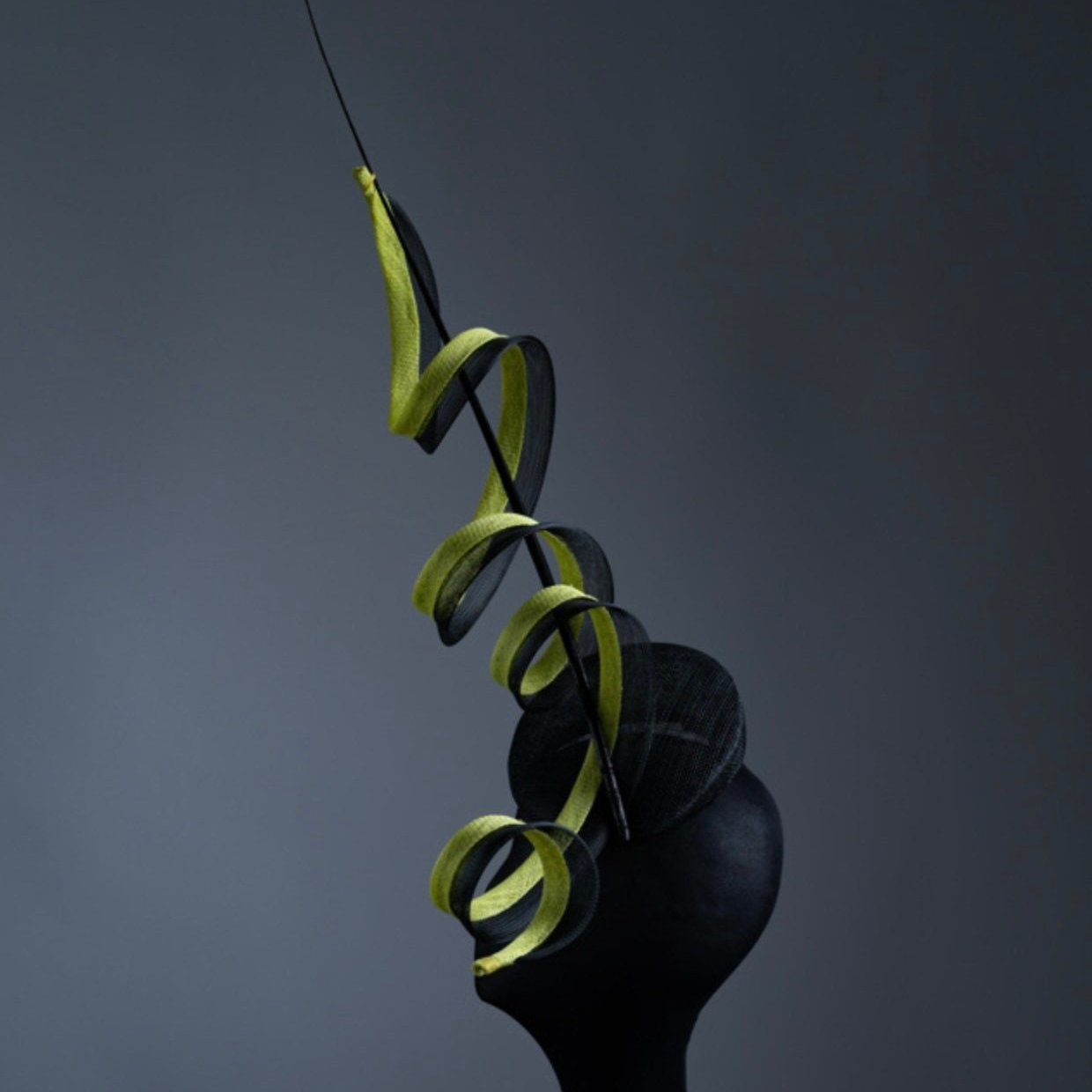 Black and acid yellow coiling Fascinator