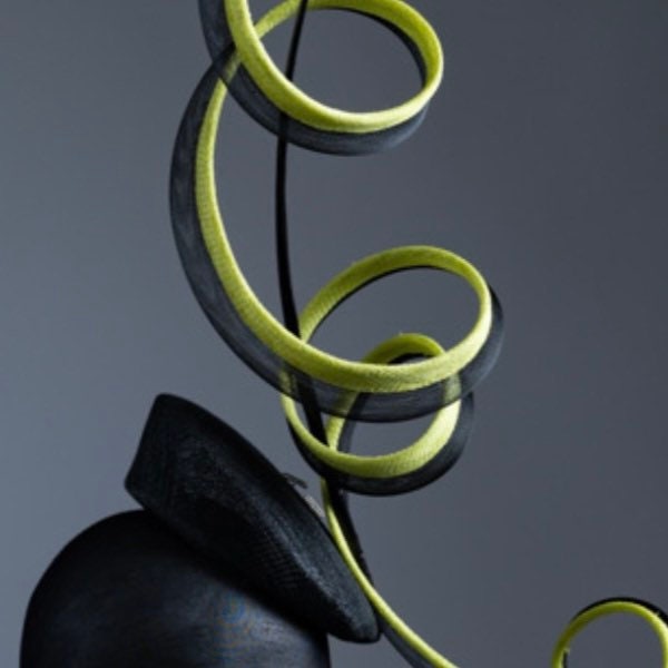 Black and acid yellow coiling Fascinator